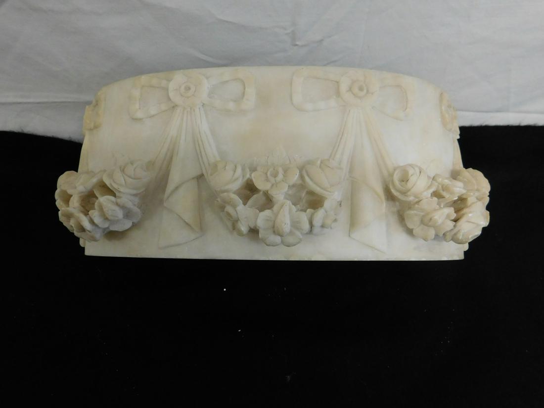 Antique Carved Alabaster Panel: Antique Carved Alabaster Panel, a deeply carved, curved alabaster panel, decorated with garlands and floral swags, possibly made for the plinth or base of a bust. Late 19th c, probably Italian. Size: 