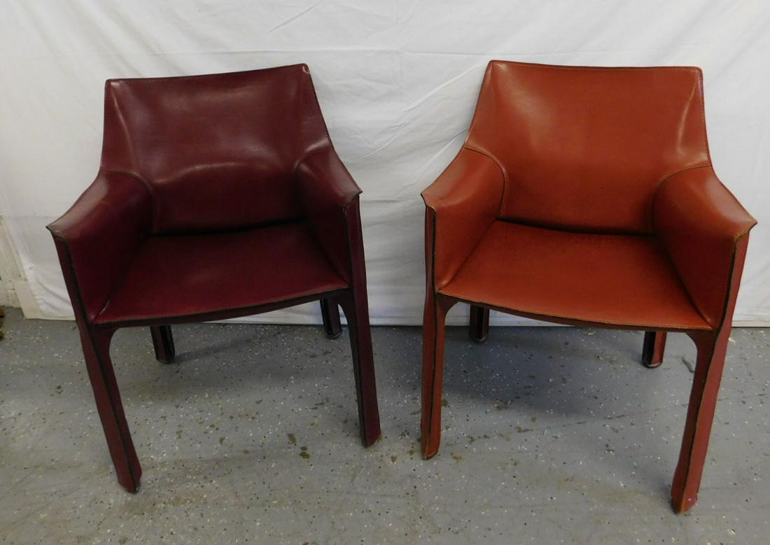 Pair Cassina Cab Armchairs: Pair Cassina Cab Armchairs. Enameled steel frames with foam seat cushions and leather zip-on covers, one in red, one in brown leather. These are the Cassina Cab # 413, designed by Mario Bellini and in