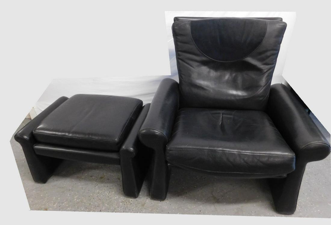 Black Leather Recliner & Ottoman: Black Leather Recliner & Ottoman. Postmodern style, black leather covered wooden frame with adjustable seat back. Loose black leather cushions with suede headrest. 1990s. chair 35 1/2" x 30" x 37" h, 