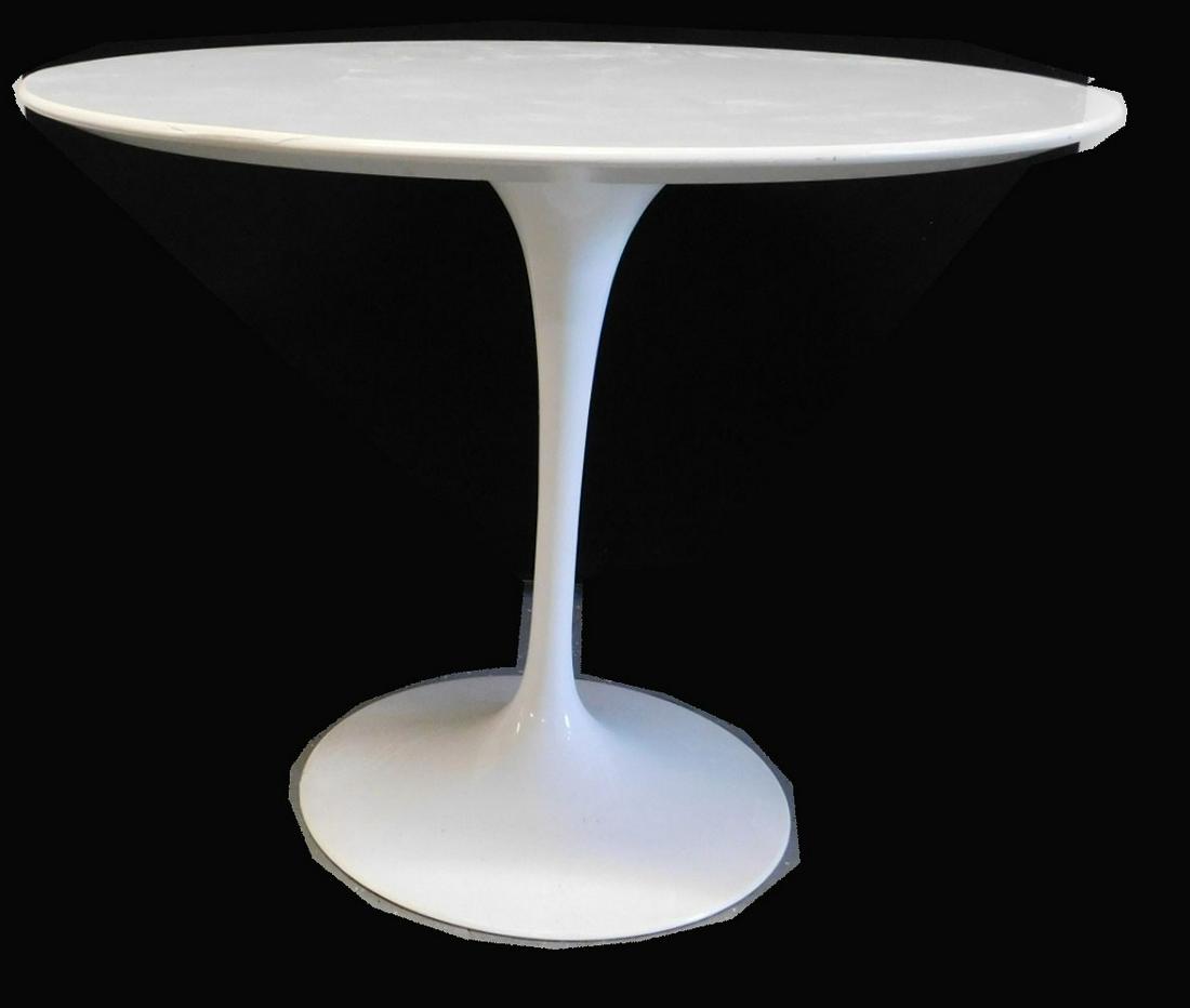 Eero Saarinen for Knoll Round Tulip Table: Eero Saarinen for Knoll Round Tulip Table, white laminate and painted top on a white enameled metal frame. Mold-marked KNOLL INTERNATIONAL on underside of foot. 1980s or 1990s. 36" w. x 28 1/2" h. CON