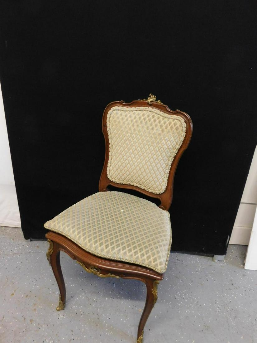 Louis XV Side Chair: Louis XV side chair, mahogany, upholstered shield back & seat cushion over caned seat, brass acanthus cast crest, knee, apron and foot mounts, early 20th c. H 38". CONDITION: Very good.