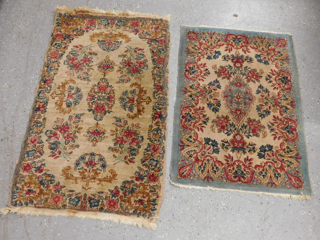 2 Kashan Throw Rugs: 2 Kashan throw rugs hand made, pale beige field with red, pastel blues and greens floral ground and borders, mid 20th c. 2.2' x 3.8' and 2.1' x 3.1'. CONDITION: Needs cleaning, some spotting some edge