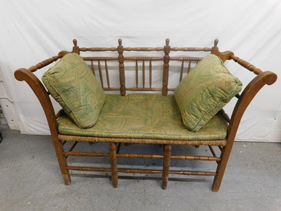 Continental Cottage Style Settee: Continental Cottage Style Settee maple and pine, features ring turned stiles, spindle back, legs and stretchers, rush seat with loose pillow cushion. 53"x37 1/2"x20" CONDITION: Small area of finish we