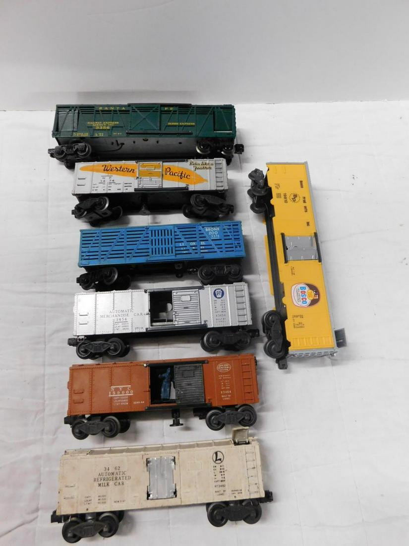 7 Lionel Operating Train Cars: Seven Lionel Operating Train Cars, "O" gauge, loose, no boxes including: Post War - Santa Fe Railway Express, Horse Express 3356, Western Pacific box car 3474, PRR Automatic Merchandise car, 3454, New