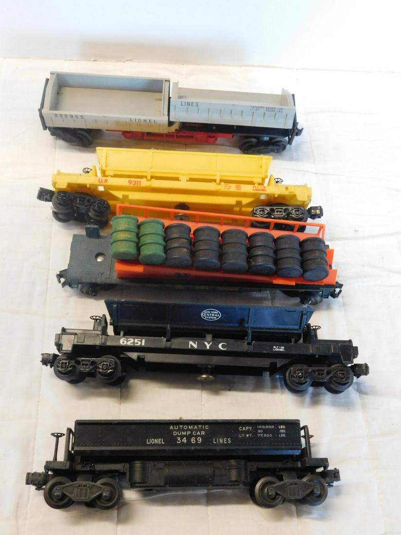 5 Lionel Operating Dump & Barrel Cars: Five Lionel Operating Dump and Barrel Cars, "O" gauge, loose, no boxes including; Post war - Lionel Lines automatic Dump car 3469, gray, Union Pacific 9311 and New York Central system 6251 and Great N