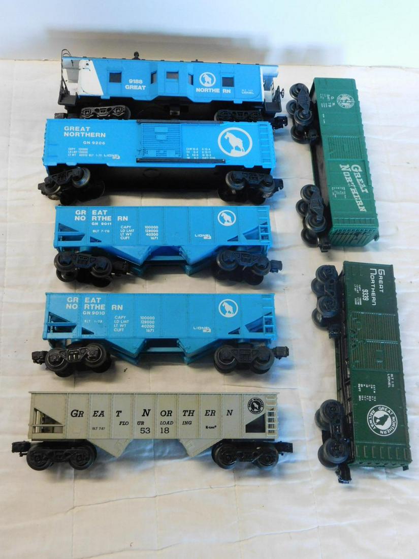 7 Modern Era Great Northern Train Cars: Seven Modern Era Great Northern Train Cars, "O" and other gauge, loose, no boxes including: Lionel, two Hopper cars 9010 and 9011 (both blue), Box cars 9206, blue and 9339, green, with bay window cabo