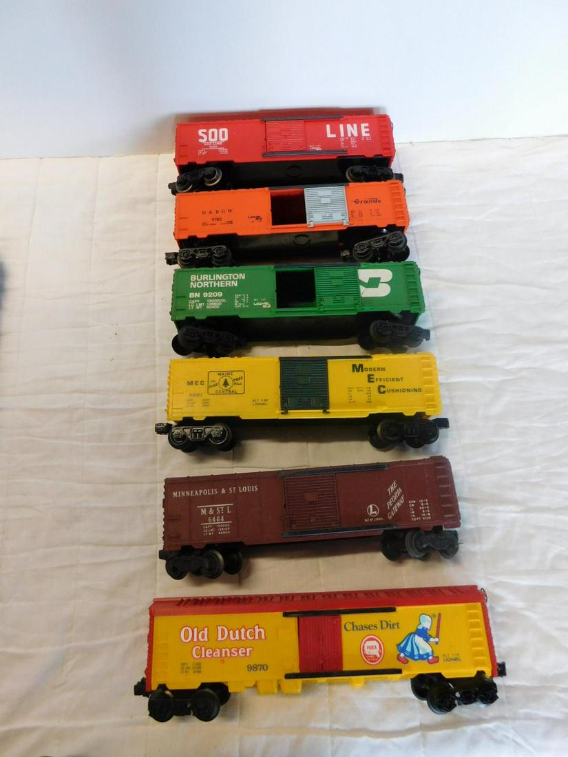 6 Lionel Box Train Cars: Six Lionel Box Train Cars, "O" gauge, loose, no boxes including: one Post war - M & St. L. 6464, plus Modern era - 500Line, 9207, MEC Maine Central, 9421, Burlington Northern, 3209, Rio Grande, D & RG