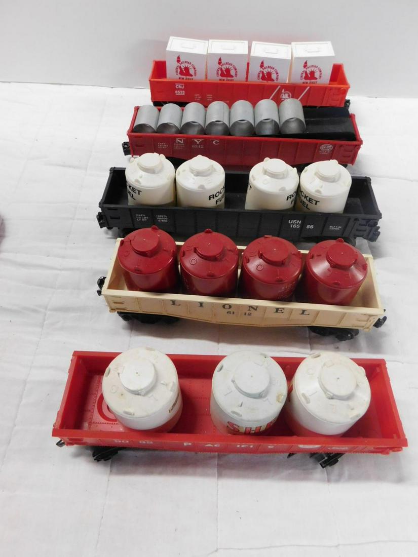 5 Lionel & Other Gondola's w/Accessories: Five Lionel and Other Gondola's w/Accessories, "O" gauge, loose, no boxes including: Lionel Post War - operating culvert car 6342 with seven metal pipe sections, Gondola car with four red containers, 