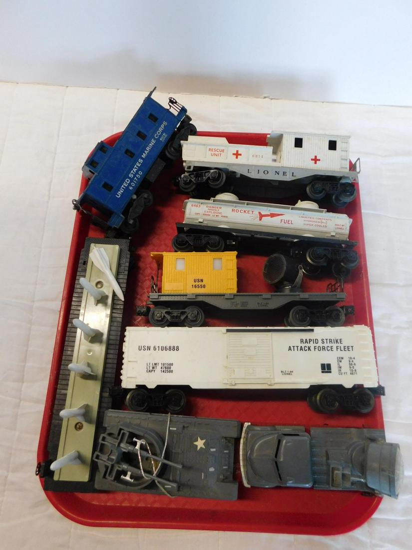 Lionel Military & Other Train Cars: Lionel Military and Other Train Cars, loose, no boxes, Post War and Modern era, "O" gauge including: Rescue Unit, 6814 (with stretchers and two seated figures), rocket fuel, 6463. Missile Carrying car