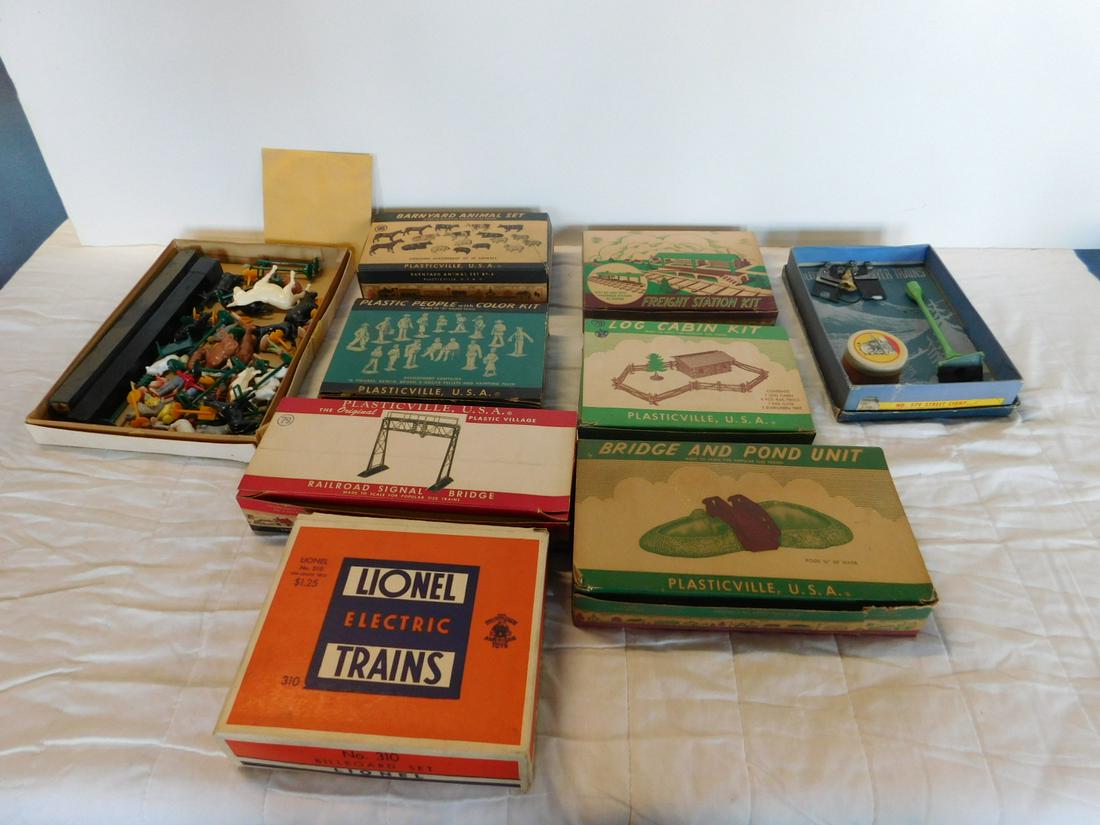 Plasticville & Other Train Accessories: Plasticville and Other Train Accessories, most in original boxes including: Plasticville - Barnyard Animal set (animals loose in another box), railroad signal bridge, plastic people, freight station k
