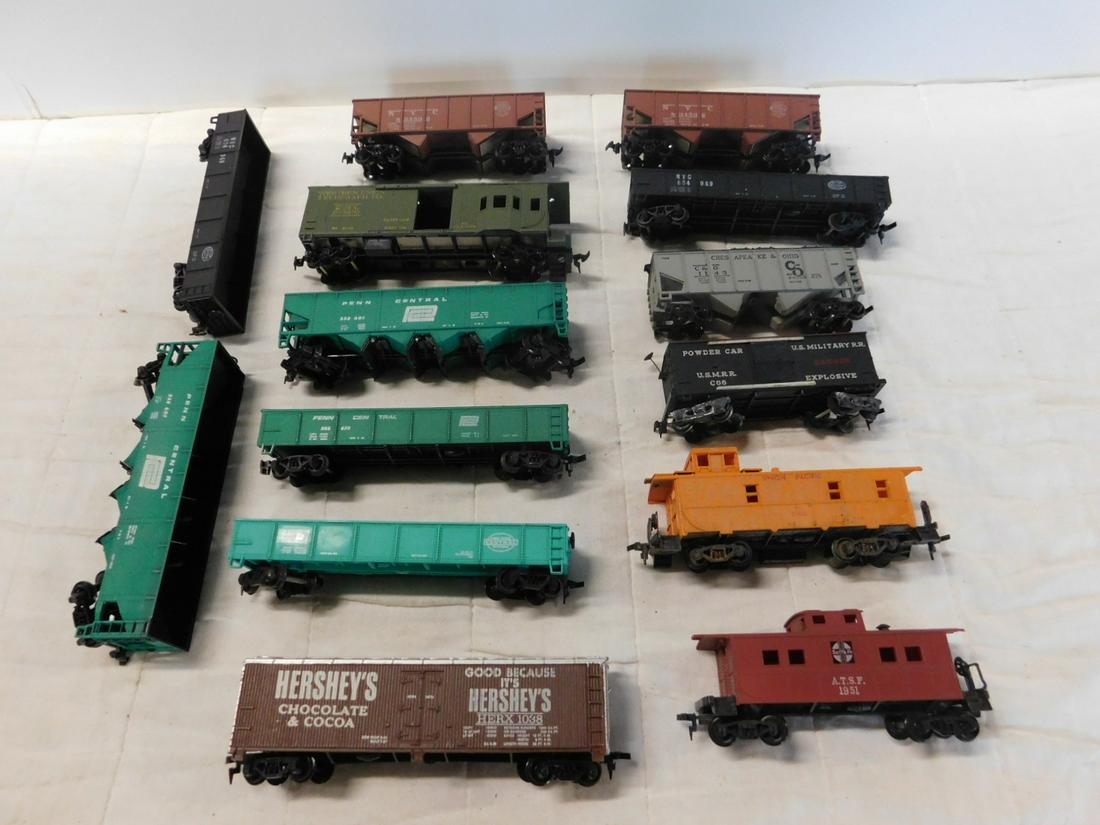 14 Assorted HO Train Cars: Fourteen Assorted HO Train Cars, Tyco, AHM and others, loose, no boxes including: four Gondola cars (two duplicate NYC), two NYC 834592, two Penn Central 258601 and one C & O 1143 Hopper car, U.S. mil