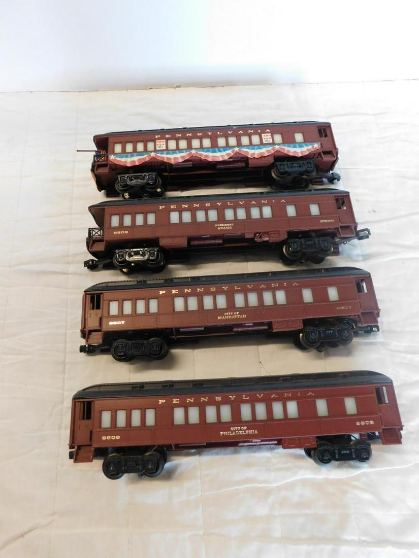 4 Lionel PRR Passenger Cars: Four Lionel PRR Passenger Cars, "O" gauge, loose, no boxes, Pennsylvania Railroad illuminated passenger cars, maroon with gray and black tops including: City of Manhattan, 9507, City of Philadelphia, 