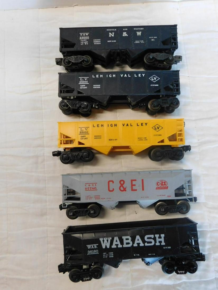 Lionel Post War Hopper Cars: Lionel Post War Hopper Cars, "O" gauge, loose, no boxes including: Norfolk and Western 22000 and two Lehigh Valley 25000 (one yellow and one black), plus Modern Era - C & EI 97786 and Wabash 36180. CO