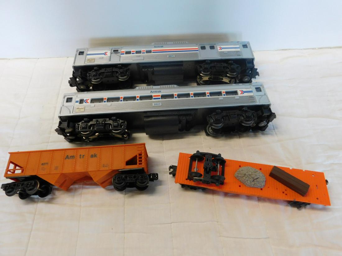 4 Amtrak Illuminated Train Cars: Four Amtrak illuminated Train Cars including; two Lionel illuminated - non powered Budd RDC passenger, 8869 and RDC baggage / mail Bud car, 8871, plus two K-Line - Amtrak hopper, 6271and repair flat c