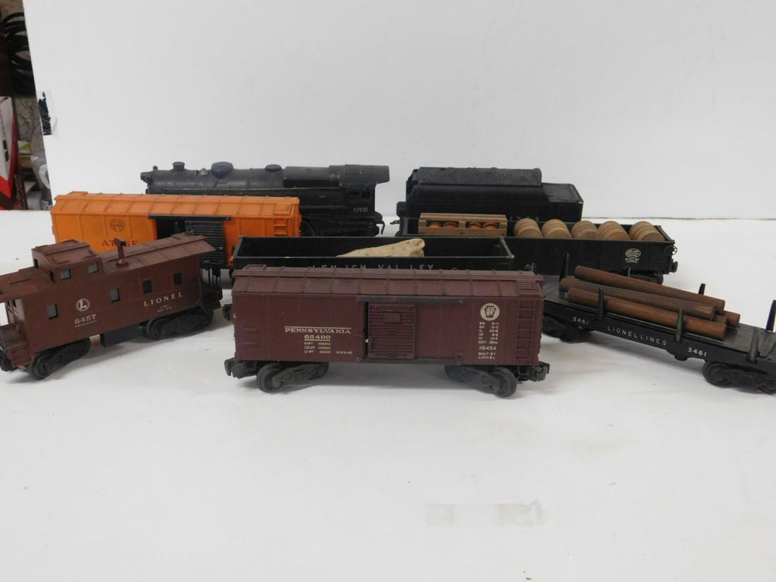 8 Pc Lionel Engine & Train Cars: Eight Piece Lionel Engine & Train Cars, postwar "O" gauge, loose, no boxes including: locomotive, No. 675 Prairie type 2-6-2 with Lionel Lines tender, plus The A.T. & S.F. Operating box car 63132, No 