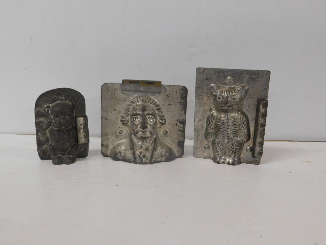 3 Vintage Chocolate Molds: Three Vintage Chocolate Molds, metal, two side clips, includes: standing Teddy bear #82, 3 3/4" x 5" x 1 1/2", and a Begging dog, 2 1/2" x 4" x 1 1/2", plus a hinged George Washington, Made in USA #81