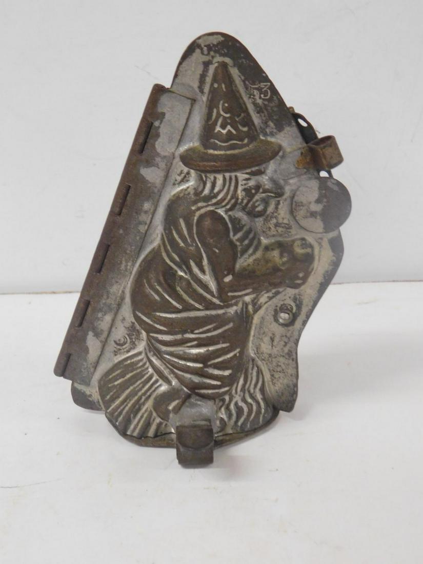 Antique Metal Witch Chocolate Mold: Antique Metal Witch Chocolate Mold, metal, hinged with clip base, mold #53, 6" x 4 1/2' X 3". CONDITION: Good, used condition, portion of top clip missing.