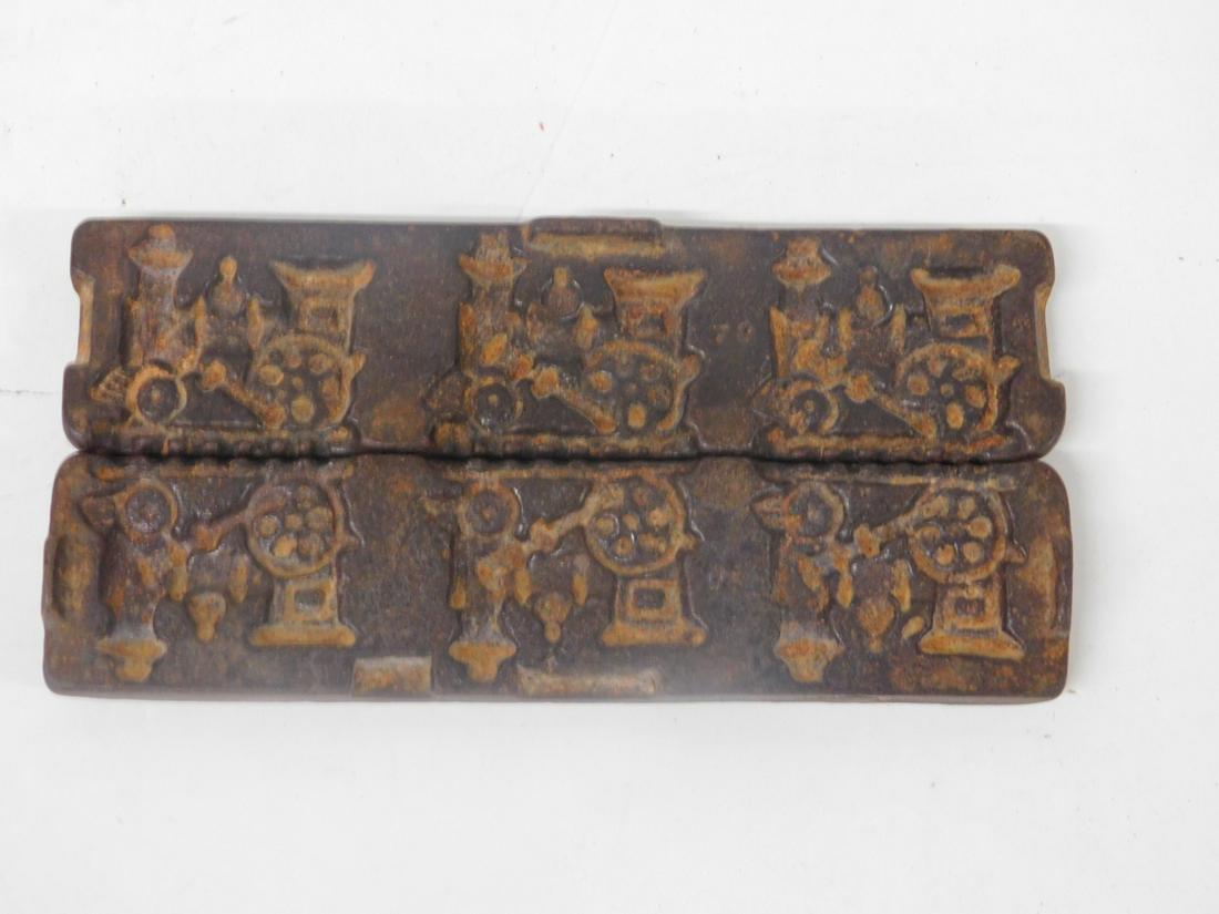 Iron Steam Engine Chocolate Mold: Iron Steam Engine Chocolate Mold, in two parts, three engines, marked "t", 6 1/4" x 2 1/2" x 1". CONDITION: Very good, used condition.