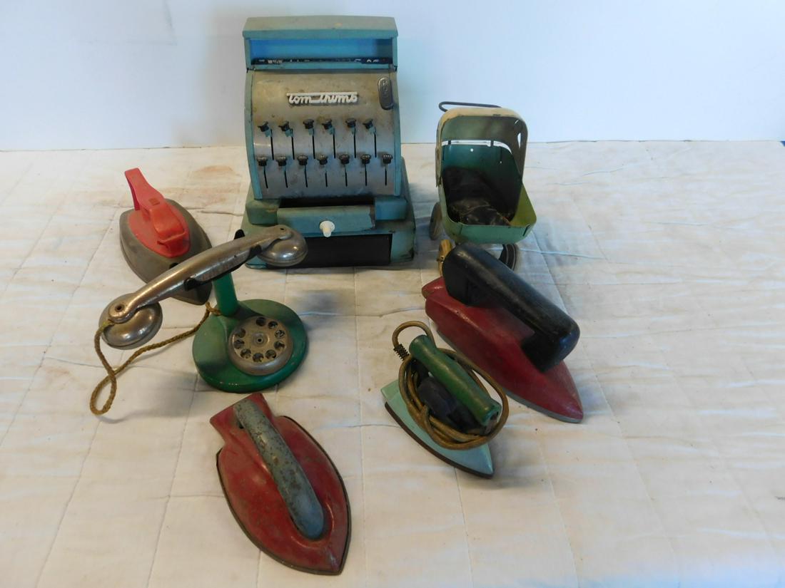 Tin & Other Vintage Toys: Tin and Other Vintage Toys including: Tom Thumb cash register, pop out top drawer with push tab bottom drawer, 6 1/2" x 7 1/2" x 8 1/2"h. tin swivel baby carriage, rubber wheels stuffed sewn figure, a