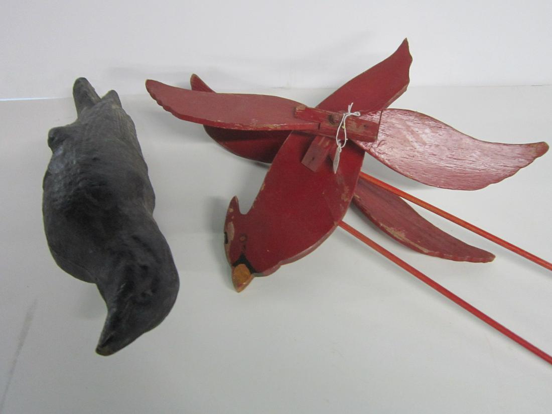 Vintage Whirligig & Bird Figure: Vintage Whirligig and Bird Figure, Cardinal whirligig with double side blades, 17" (total length, bird 15"l, with two wood sticks, plus black paper mache raven bird lawn figure, 16"l, (no pole). CONDI