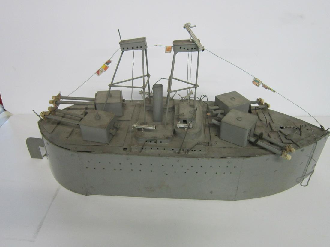 Metal Vintage Battleship: Metal Vintage Battleship with turrets front and back, towers and flag lines,front anchor and chain, with rudder, hand made, riveted and with nuts and bolts, 31"l. CONDITION: May be missing a few piece