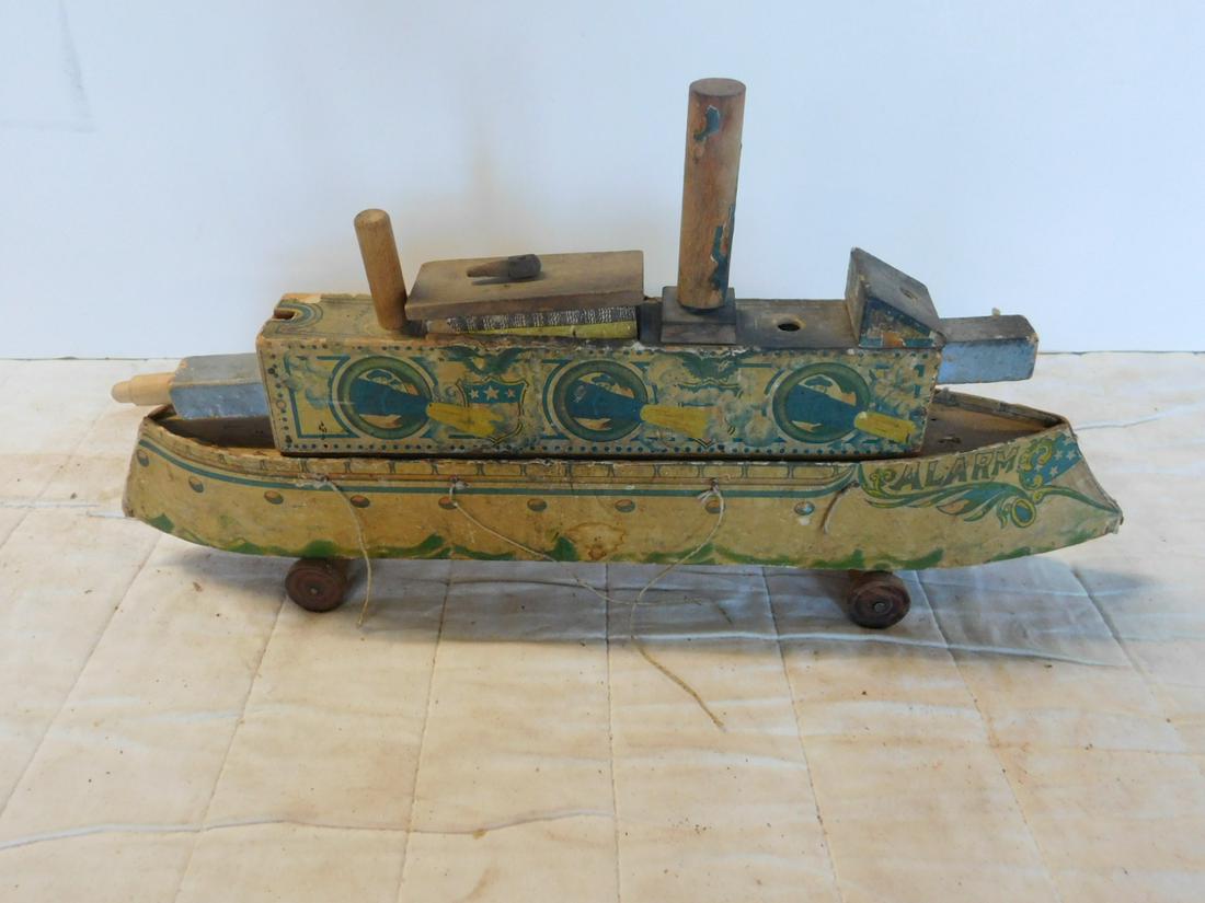 Late 19th C Litho Battleship Pull Toy: Late 19th C Litho Battleship Pull Toy, paper litho on wood, "ALARM", 17 1/2 on front and back wood wheels, front and back turrets (missing masts and flags), late 19th C. CONDITION: Some staining and m