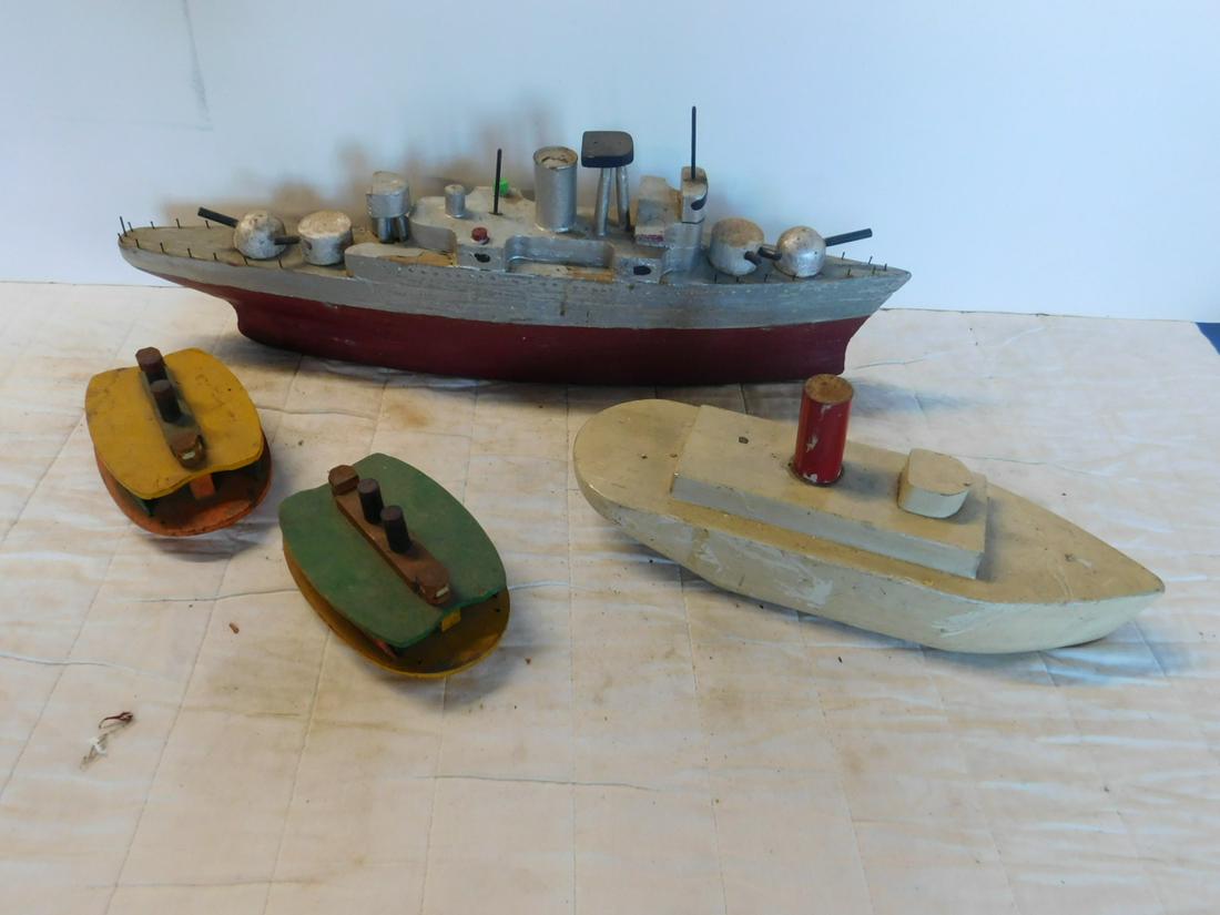 4 Antique Wood Toy Boats: Four Antique Wood Toy Boats including: Battleship, gray and red with turrets front and back, 24"l, painted tugboat, beige with red stack, 15" and two small Ferry boats with painted side windows, (no c