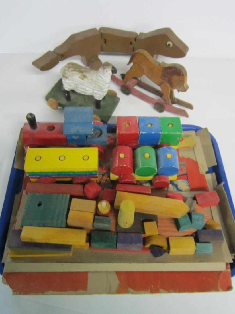 Vintage Wood Pull & Other Toys: Vintage Wood Pull and Other Toys including: three animal pull toys,sheep, 6" l x 5 1/2"h, lion, 9" x 4 1/2"h, jointed lizard, 15 1/4"l, plus blocks locomotive and cars, 23" overall and Build a Boat wi