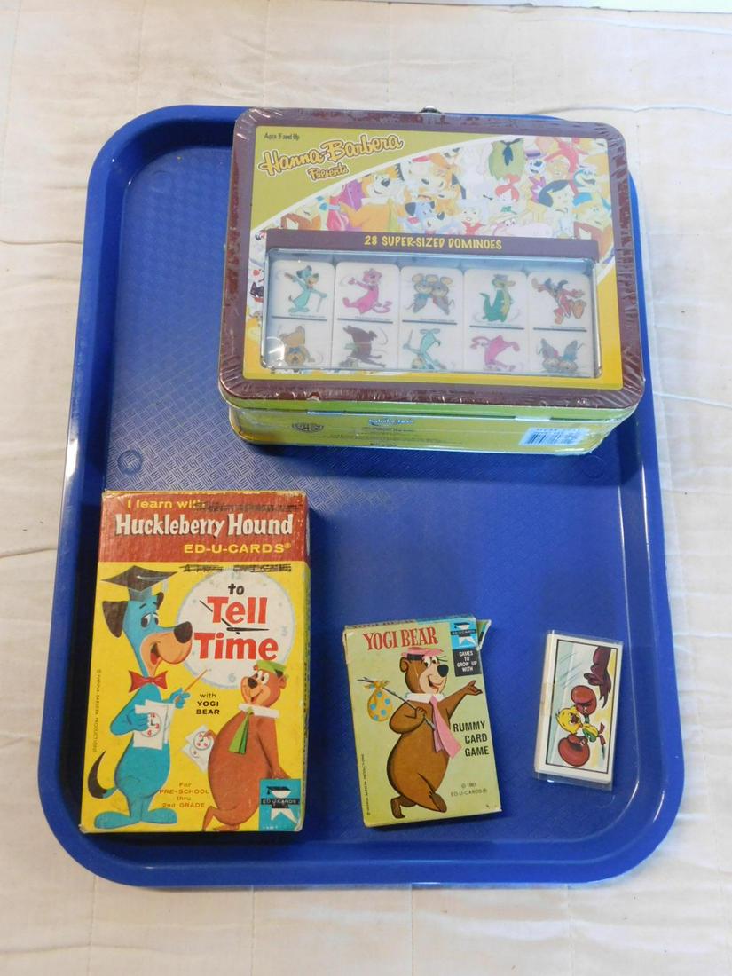 4 Vintage Hanna Barbera Cards & Games: Four Vintage Hanna Barbera Cards and Games including: 28 Super - sized dominoes (factory sealed) in tin lunchbox container, 7" x 7 3/4" x 2 3/4" with plastic handle, set of Huckleberry Hound Ed - U - 