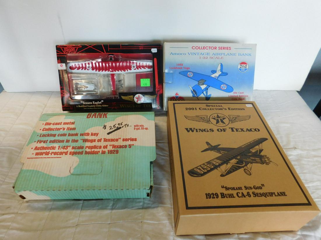 4 Die Cast Plane Banks in Original Boxes: Four Die Cast Plane Banks in Original Boxes including: one Wings of Texaco Special 2001 Collector's Edition "Spokane Sun - God", 1929 Buhl CA-6 Sesquiplone, one "The Texaco 5", one Wings of Texaco "Te