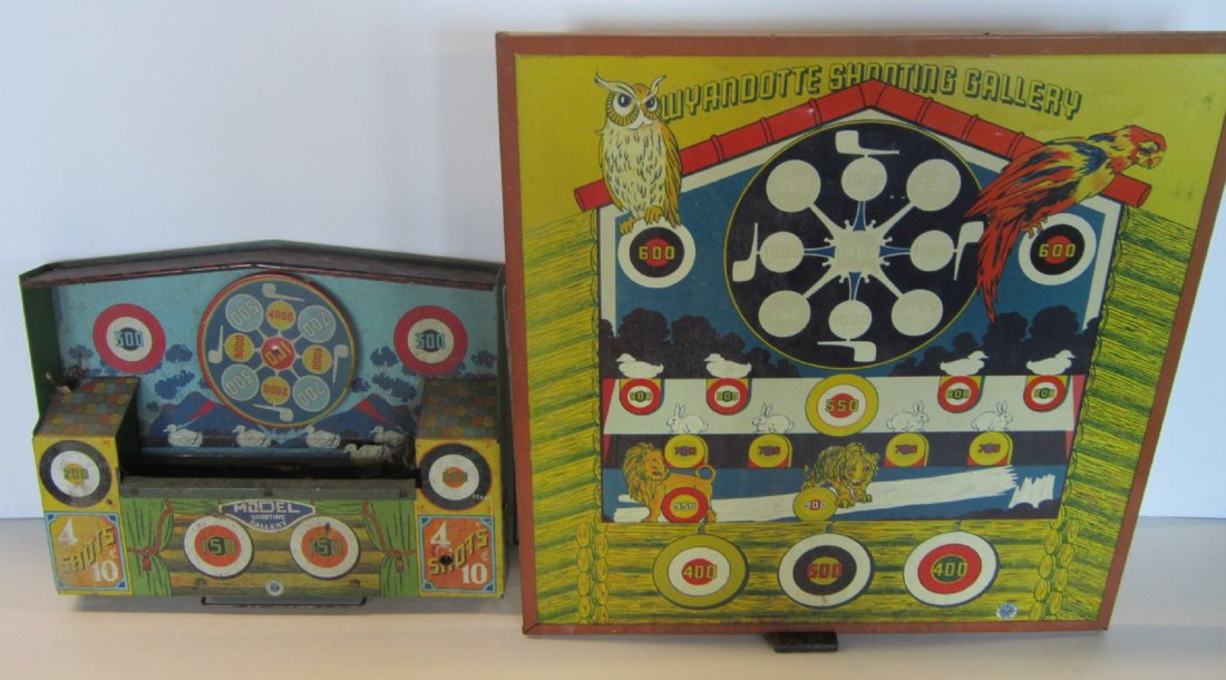 Vintage Shooting Galleries: Vintage Shooting Galleries including; tin litho Model Shooting Gallery, "4 Shots - 10¢, 14" x11"h. and paper litho Wyandote Shooting gallery (with reverse dart board), 18" x 18 1/4" h., both with wir