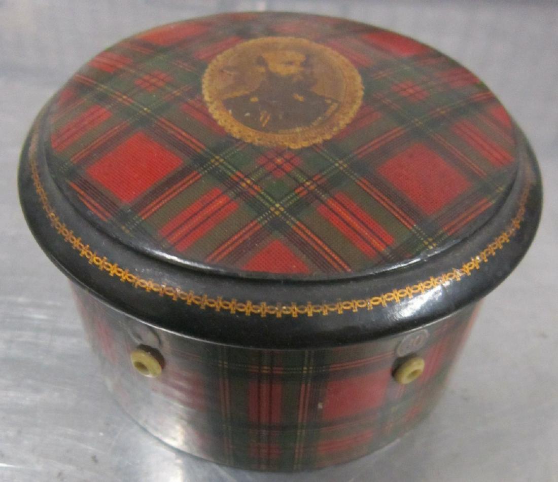 Mauchline Ware Stuart Tartan Thread Box: An unusual turned wood mauchline ware box made to hold six spools of thread, which can be dispensed though small holes in the side of the box. Decorated in the Stuart clan tartan, with an image of an 