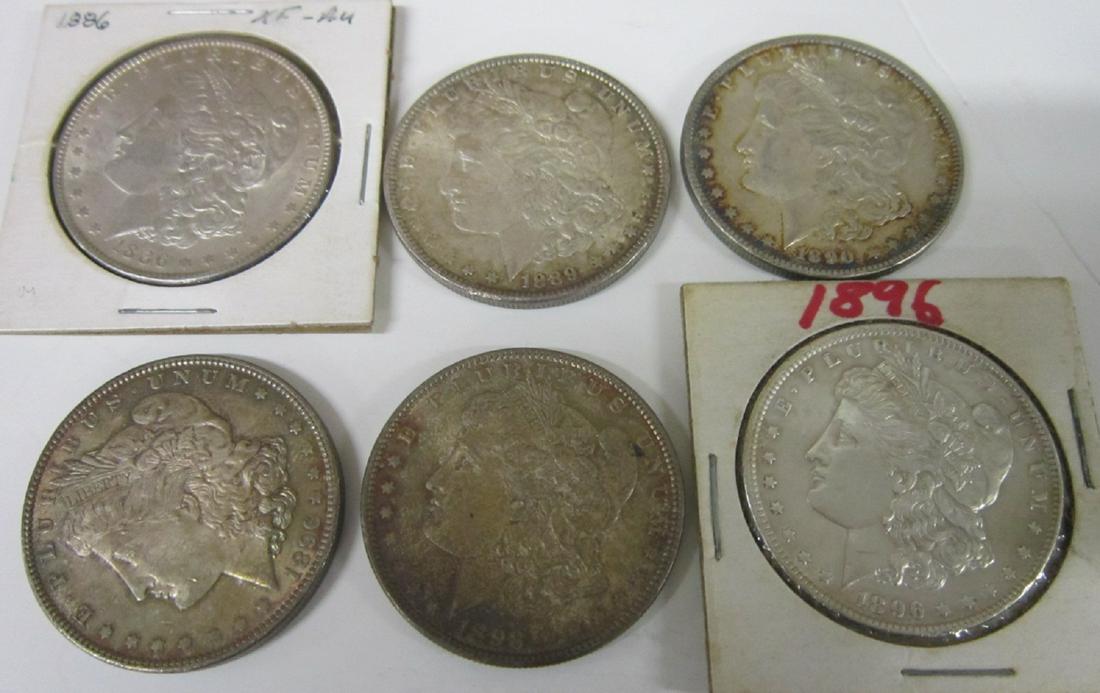 6 US Silver Dollars: Six US Silver Dollars, 1886 XF-AU;1889 - XF, 1890 XF - AU, two 1896 - AU & Unc. 1898 - AU. CONDITION: AU, XF to Unc.