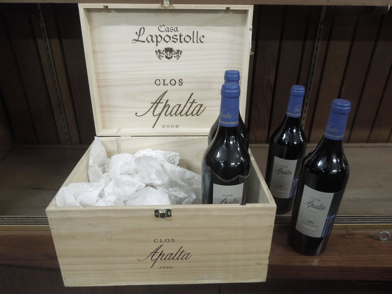 Case of 4 Clos Apalta 2006: Case of 4 Clos Apalta 2006, Lapostolle Special Label, blend of Carmenere, Merlot, Cabernet Sauvignon grapes, Chile, 750 ML. in wood case. CONDITION: No issues identified. All wine is from a local esta