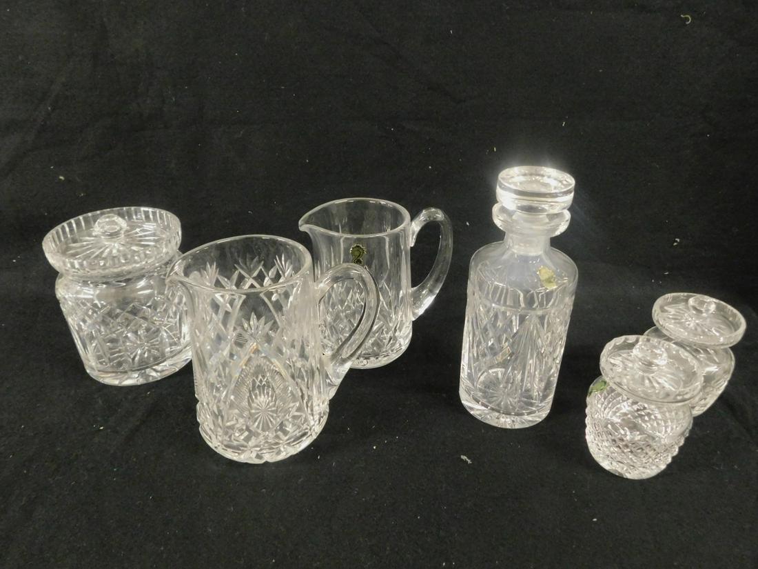 6 Pc Waterford Crystal: Six Pieces Waterford Crystal includes: 9 1/4" decanter, 6 1/2"h x 5"d, biscuit jar, two 4 3/4" h x 3"d, condiment jars, 7" and 5 1/2" pitchers. CONDITION: Very good.