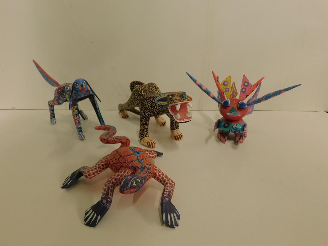 4 Mexican Painted Oaxacan Wood Animals: Four Mexican Painted Oaxacan Wood Animals, Oaxaca, Mexico, includes: Aaron Jimenez blue floral standing dog 7 1/2"l; Alba Hernandez spotted leopard, 10"l, 4"h, Jesus Hdzt? orange lizard, 7" x 6 1/2" x