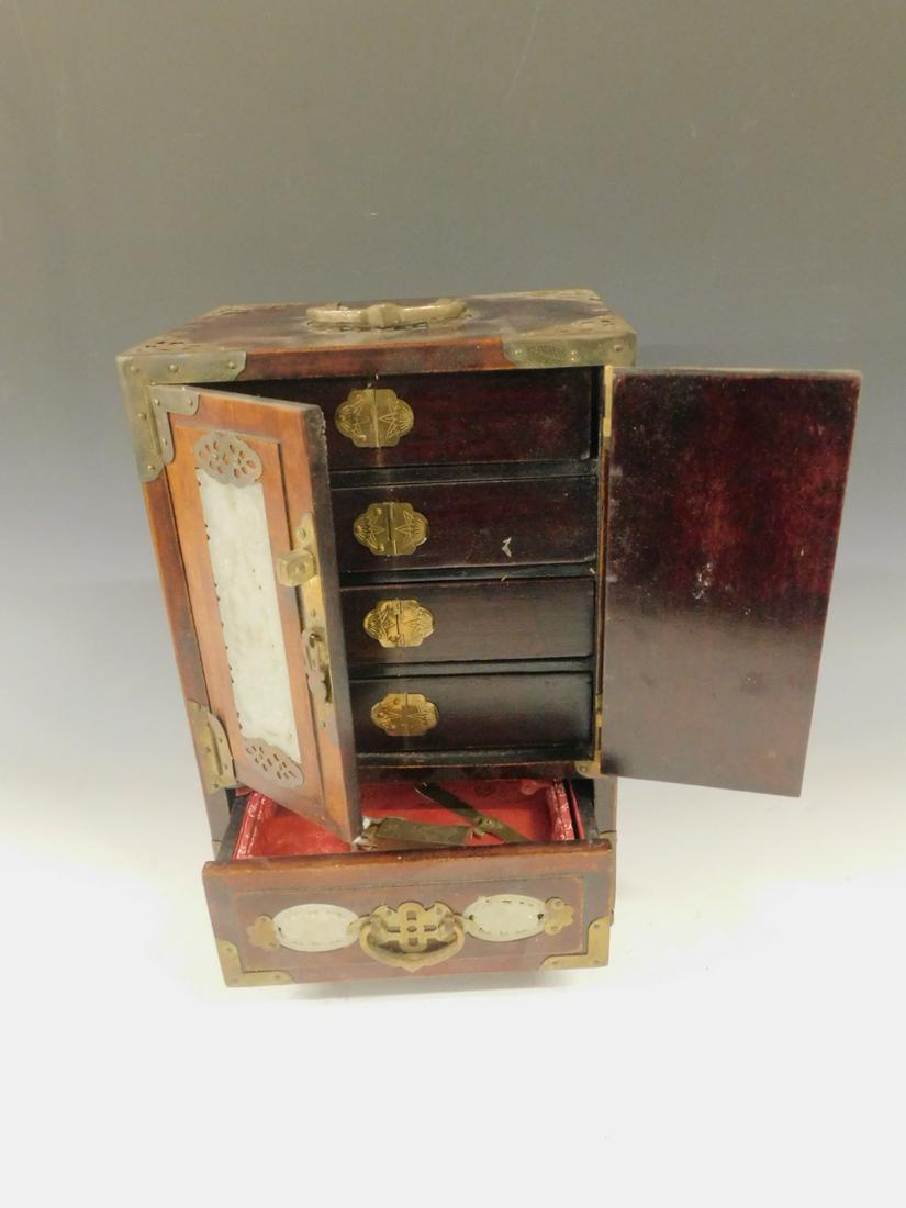 Chinese Jewelry Case: Chinese Jewelry Case, hardwood case with brass mounts and carved and reticulated celadon green jade ? panels, features two doors with interior drawers over single base drawer, key with lock, 20th C, 7