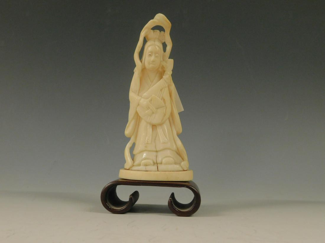 Chinese Musician Carving: Chinese Musician Carving, depicts a standing robed female holding a lute type string instrument, signed on base, late 19th C, 4 1/8" h, wide base. CONDITION: Expansion cracks on base of figure.