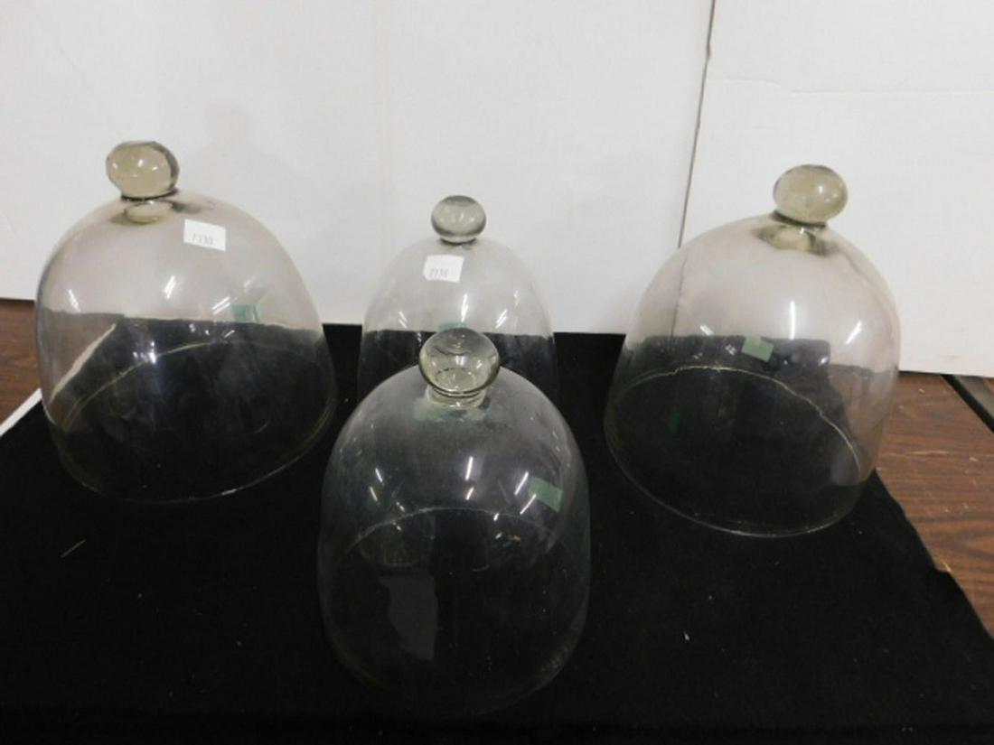 4 Vintage Glass Domes: 4 Vintage Glass Domes, clear blown glass with knob top finials, two approx 10"h x 10 1/2"d and two approx 8"h x 8 1/2"d. CONDITION: Very good.