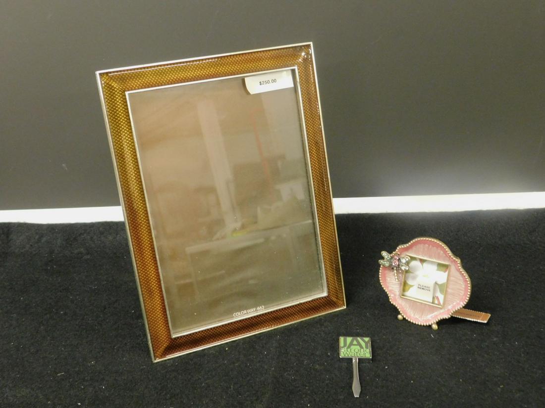 2 Jay Strongwater Picture Frames: Two Jay Strongwater Picture Frames includes: model 7662 rectangular narrow enameled carmel band frame,6" x 8 1/4", interior 5" x 7", and a jeweled dragon fly on a mini pink enameled frame, 2 3/4' x 2 