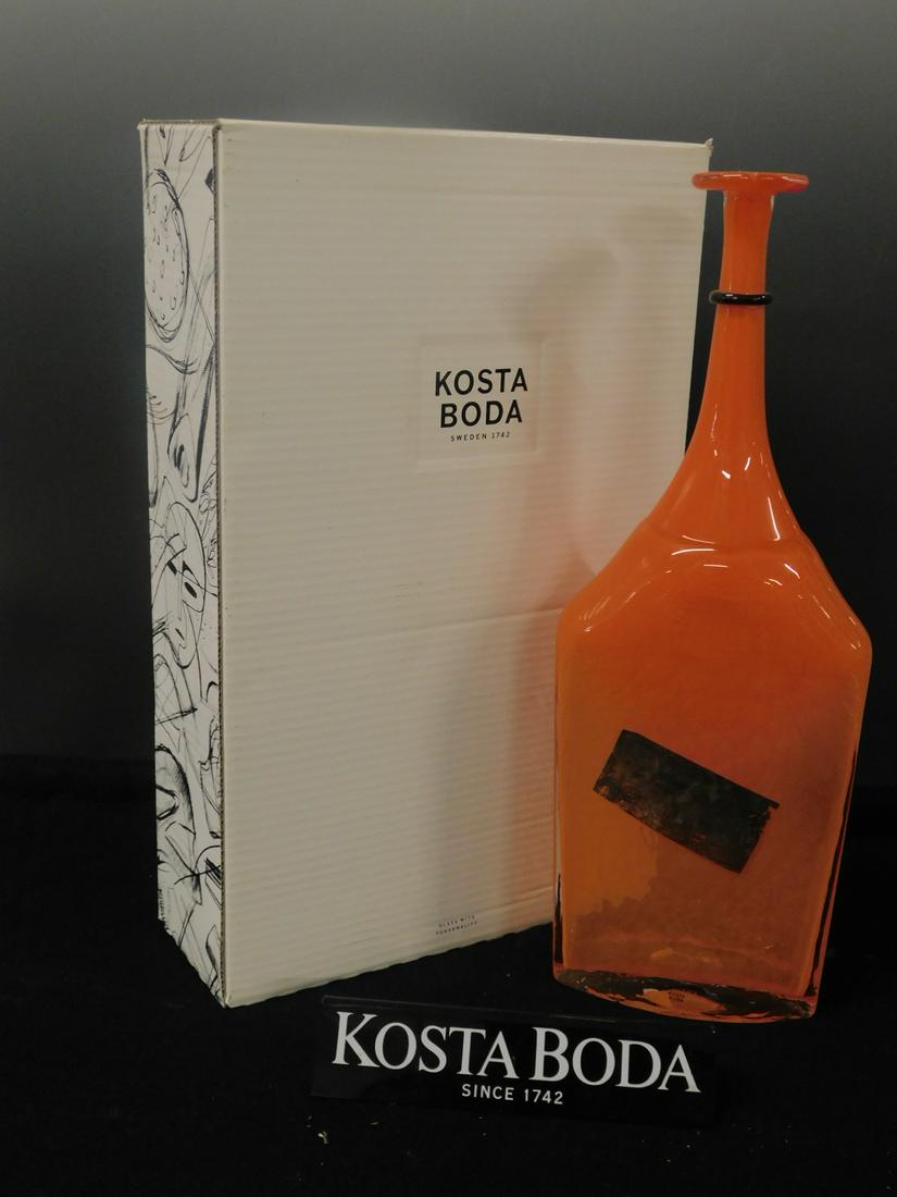 Kosta Boda Orange Satellite Bottle: Kosta Boda Satellite Bottle, orange crystal with black and distressed silver accents, designed by Berth Vallien, model 7080707, Sweden, approx 18"h. CONDITION: Like new in box.
