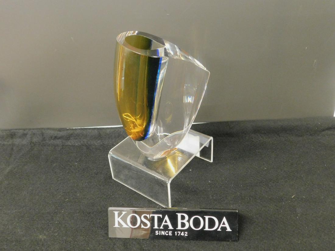 Kosta Boda Mirage Vase: Kosta Boda Mirage Vase, clear to amber crystal, designed by Goran Warff, model 7040707, Sweden, 7 7/8"h. CONDITION: Like new in box.