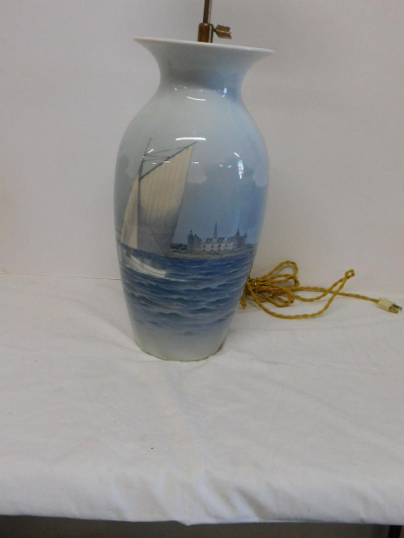 Royal Copenhagen Vase / Lamp: Royal Copenhagen Vase / Lamp, 17" baluster form vase i typical blues depicting sail boat in a cityscape harbor, brass fitting for electric, over all height 29 1/2". CONDITION: Excellent.
