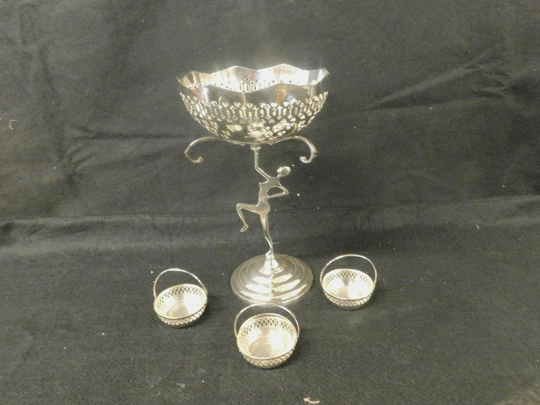 Art Deco Center Piece: Art Deco Center Piece, Continental, silver plate, features a reticulated 7 1/4" d bowl with three arms holding three reticulated baskets with glass inserts; all supported by a flat cast standing femal