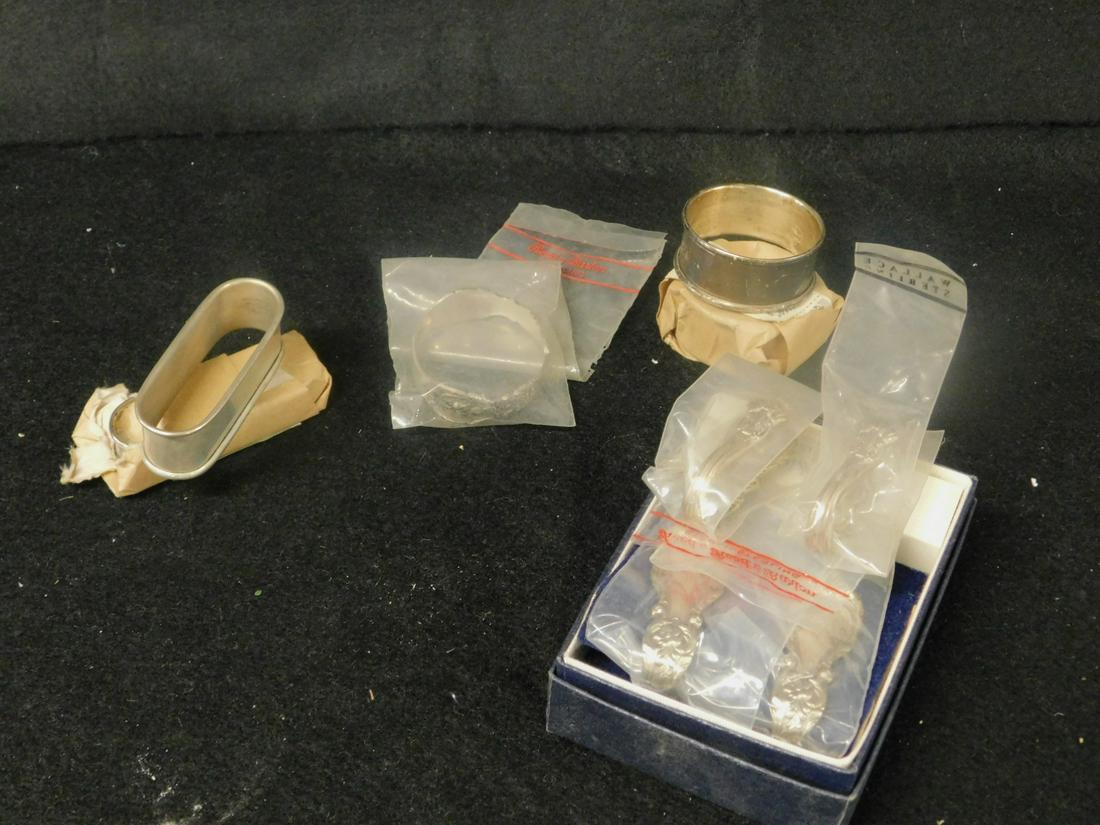 9 Sterling Napkin Rings: Nine Sterling Napkin Rings includes: pair of Reed & Barton boxed napkin clips in floral and acanthus pattern; three International sterling napkin rings, two round, two oval; Reed & Barton floral and f
