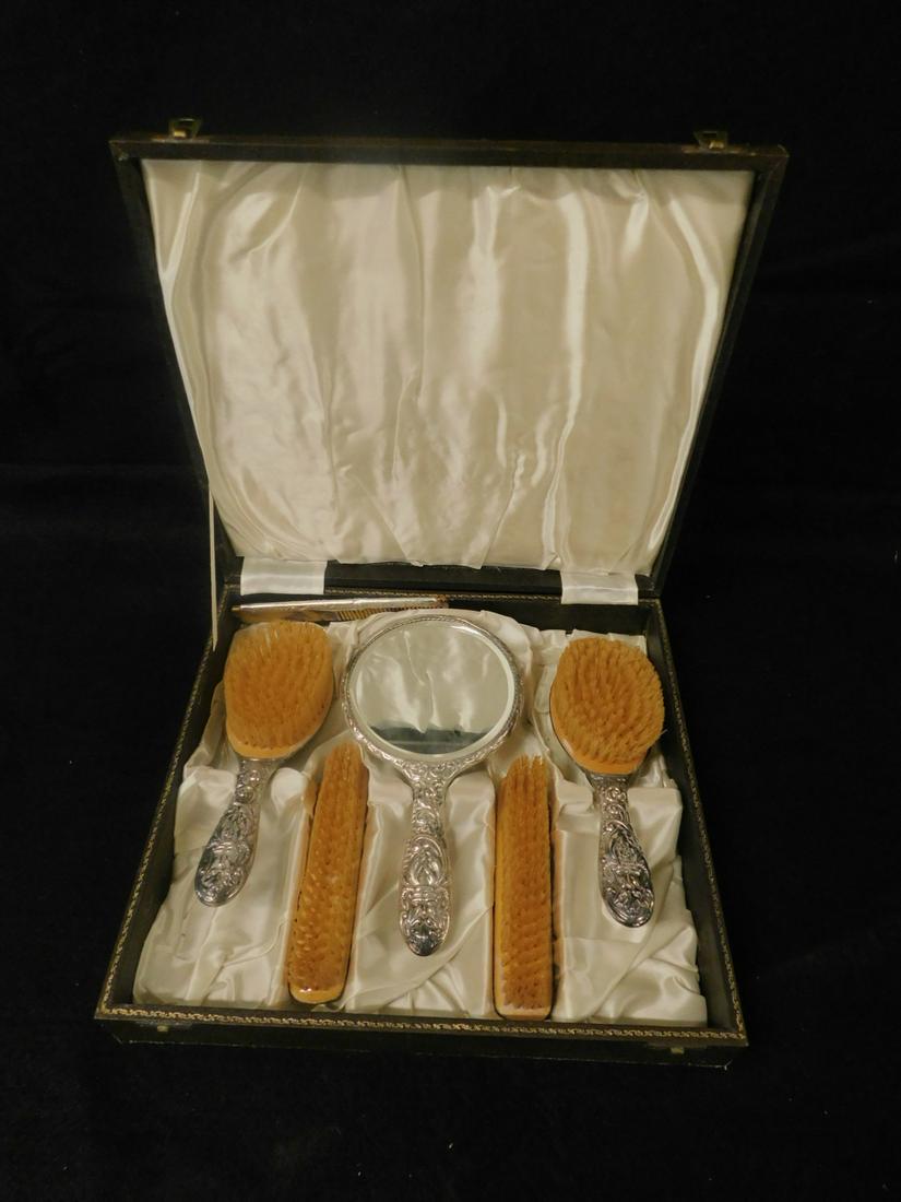 6 Sterling Repousse Vanity Set: Six Sterling Repousse Vanity Set, touch marked Birmingham England, 1953, "B & Co" - WI Broadway & Co.; fitted box containing hand mirror, comb, two handled hair brushed, two handleless brushes; featur