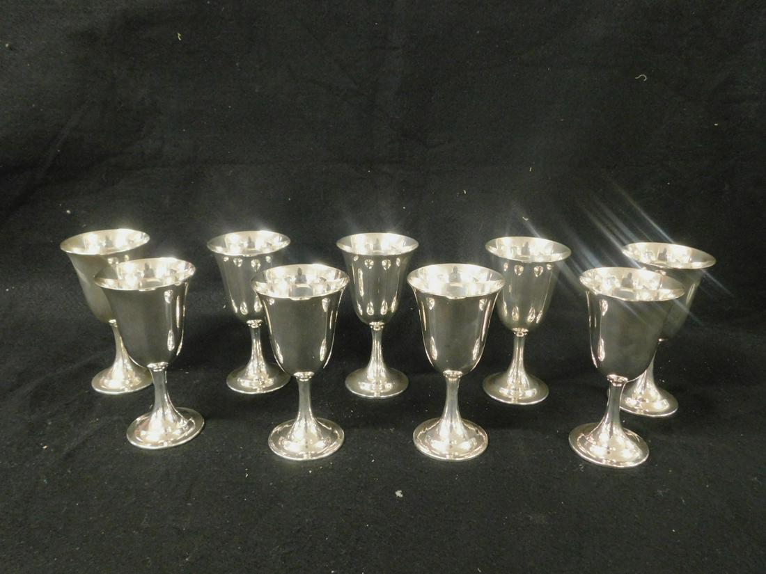 Set of 9 Sterling Wine Goblets: Set of nine Sterling Wine Goblets, International Sterling Silver, Lord Saybrook pattern, 6 5/8"h, 52.99 ozts TW. CONDITION: Excellent, no issues identified.