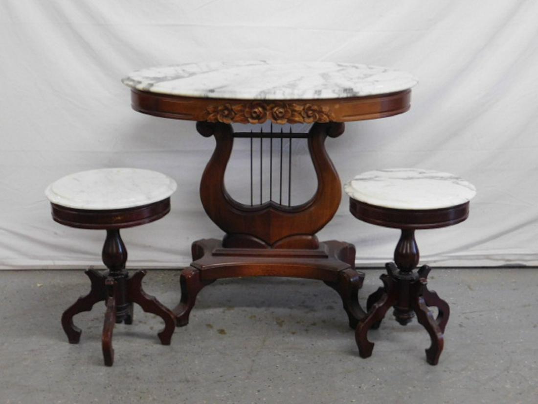 3 Pc Victorian Style Table Set: Three Piece Victorian Style Table Set, mahogany, all with white marble tops; lyre form pede4stals on shaped feet on center table, 28 1/2" x 22" x 34", plus pair of tabourets, with 14"d round white mar