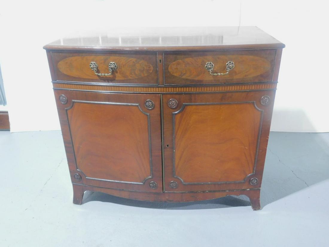 Hepplewhite Style Server: Hepplewhite Style Server, mahogany, bow front, panel inlay border, features: two drawers over two doors with applied rosettes, French bracket feet mid 20th C, 34" x 22" x 44". CONDITION: Few small are