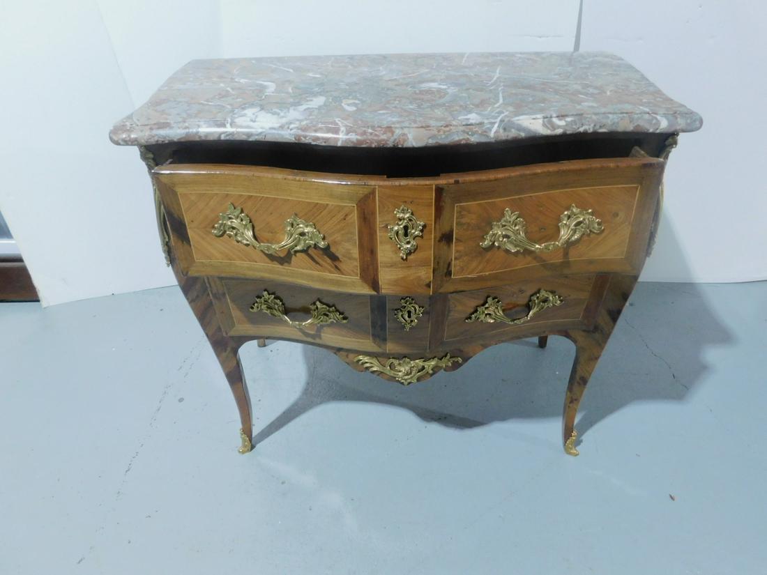 Louis XV Commode: Louis XV Commode, banded and figured mahogany, veined rouge molded edge marble top, serpentine front; two drawers, Dore bronze cast acanthus leaf mounts, pulls, escutcheons, corner and apron mounts an
